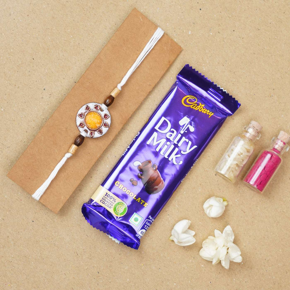 Handmade Sooraj White Copper Enamel Rakhi With Chocolates And Roli Chawal - Rakhi with chocolate gift set