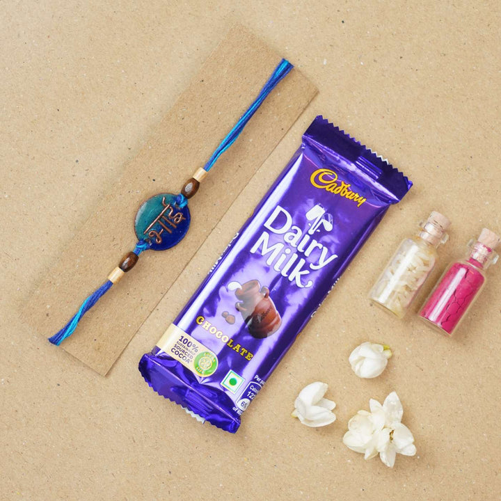 Handmade Bhai Blue Copper Enamel Rakhi With Chocolates And Roli Chawal - Rakhi with chocolate gift pairing