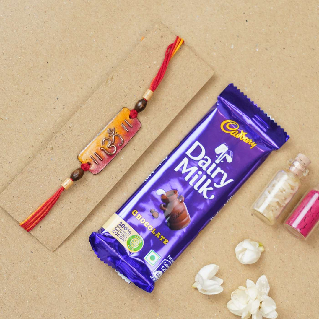 Handmade Rectangle Om Copper Enamel Rakhi With Chocolates And Roli Chawal - Packaging and Gift Combo