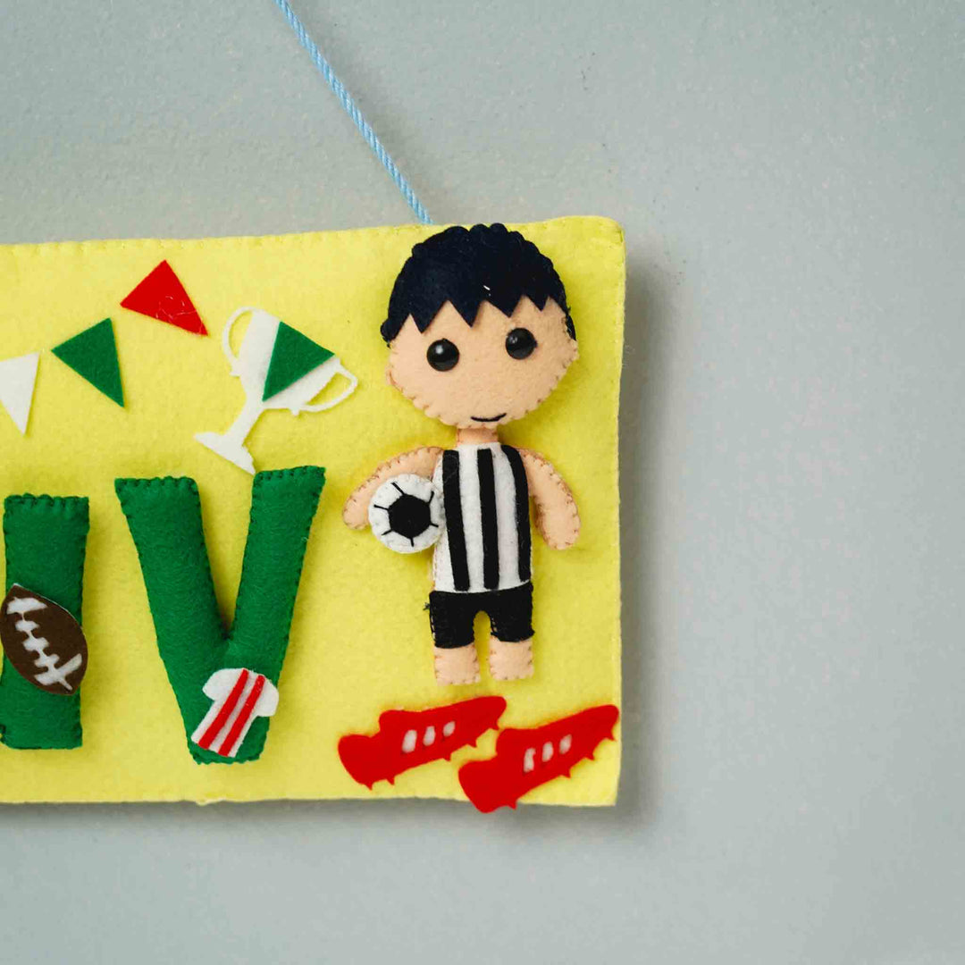 Handcrafted Sports Themed Rectangle Felt Name Plate For Kids - Partial Close-up Hanging View