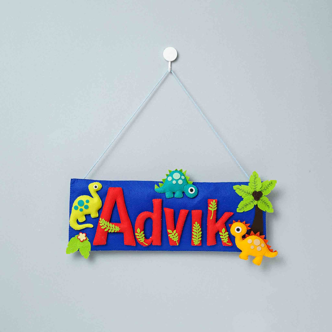 Handcrafted Dinosaur Themed Rectangle Felt Name Plate For Kids - Hanging from Wall Hook Front View