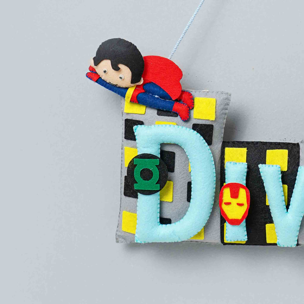 Handcrafted Superhero Themed Rectangle Felt Name Plate For Kids - Hanging Close-up with Character Detail