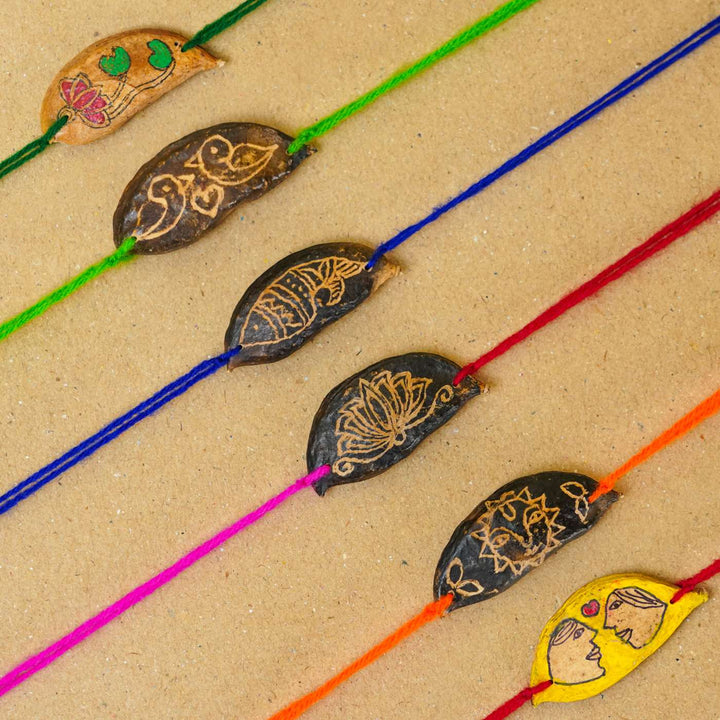 Handmade Plantable Magenta Lotus Seed Rakhi With Roli Chawal - Multiple rakhis in various colors