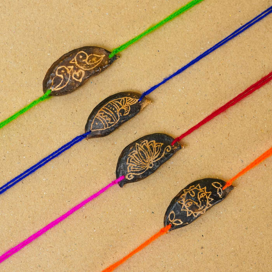 Handmade Plantable Ropan Seed Rakhi With Roli Chawal Set Of 4 - Close-up of four rakhis