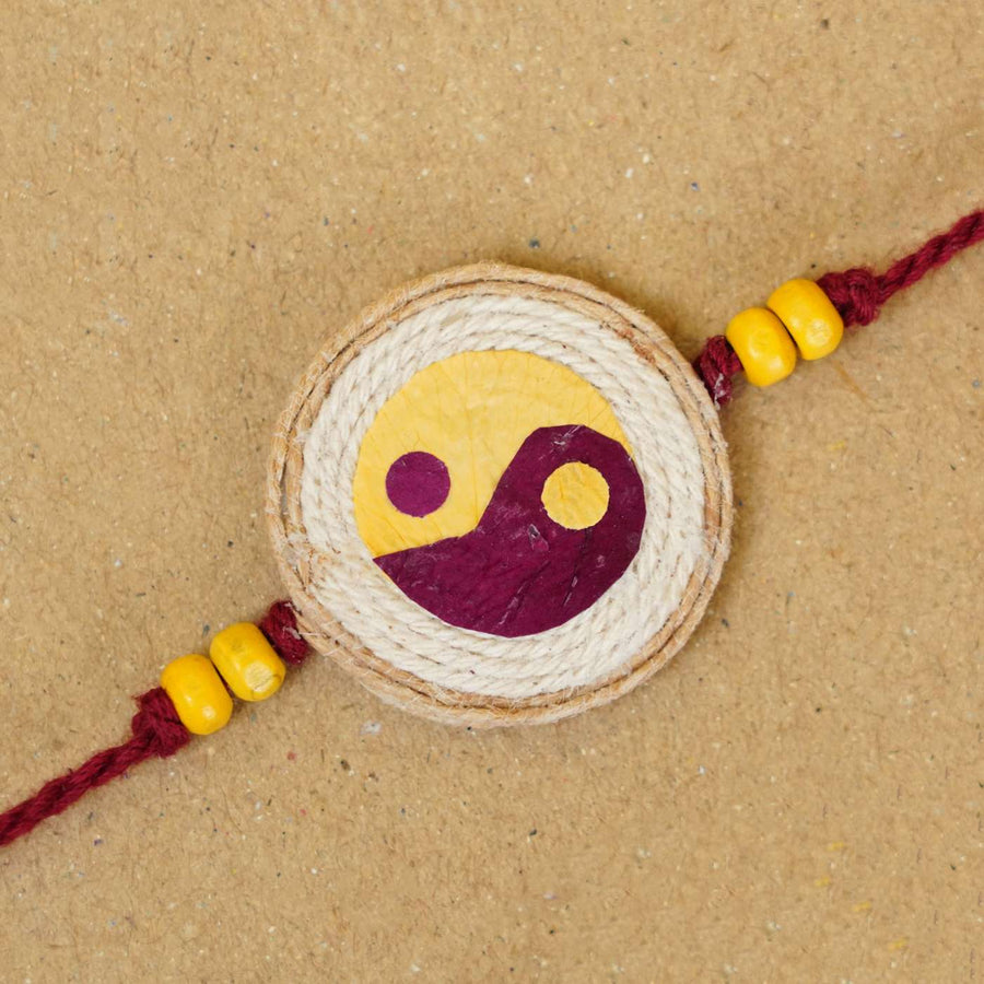 Handmade Pressed Flower Art Yin And Yang Jute Rakhi With Roli Chawal - Close-up of Rakhi Thread Center