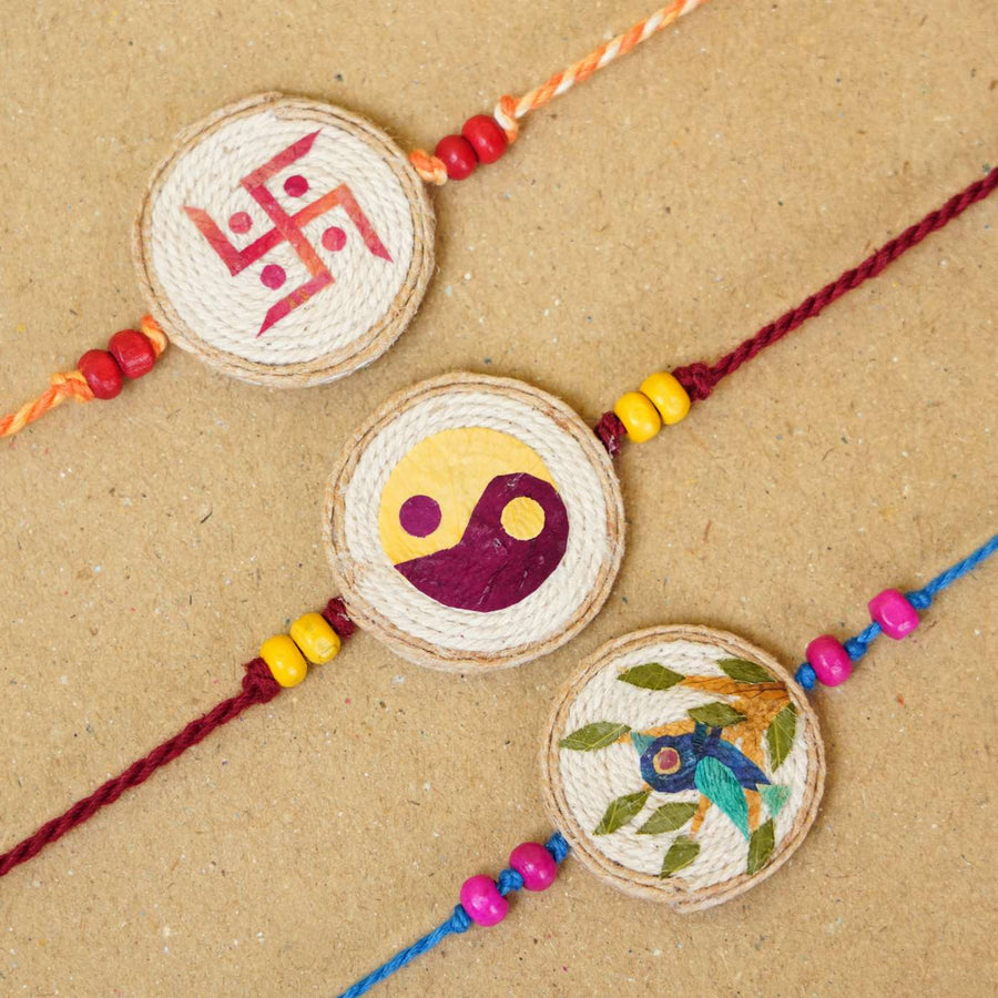 Handmade Pressed Flower Art Multi Colours Jute Rakhi With Roli Chawal Set Of 3 - Close-up of three bracelets