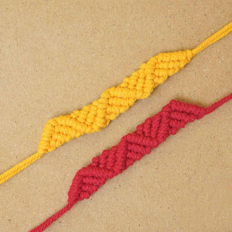 Handmade Macrame Red And Yellow Cotton Bracelet Rakhi With Roli Chawal Set Of 2 - Close-up of Two Bracelets
