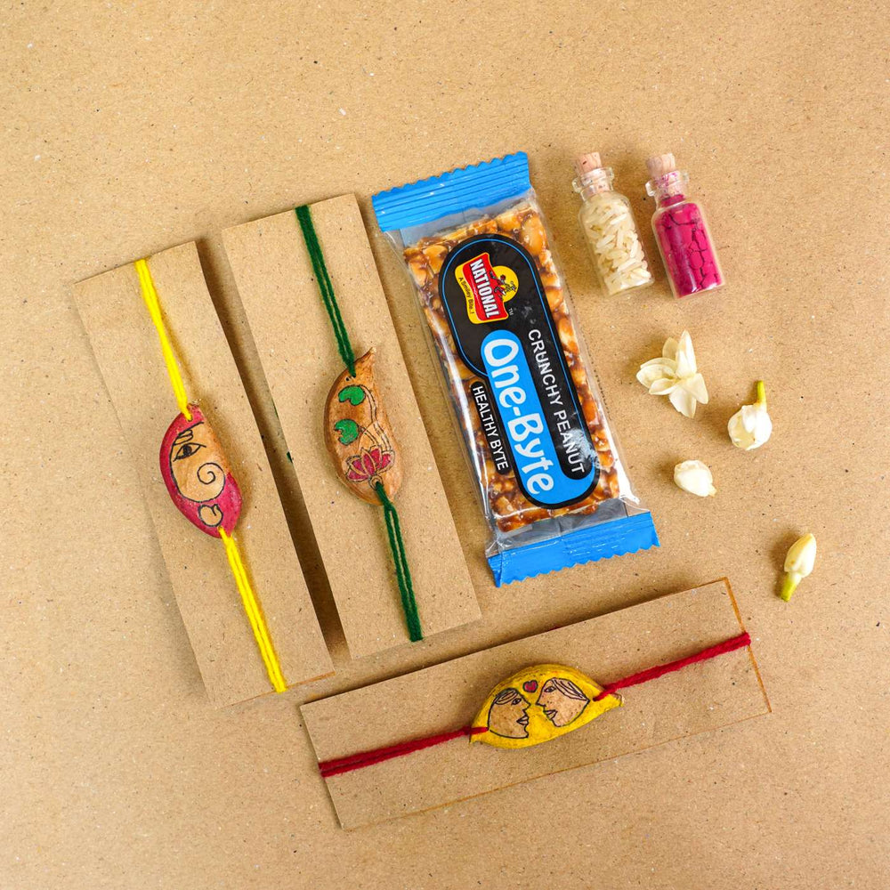 Handmade Plantable Ropan Seed Rakhi With Roli Chawal Set Of 3 - Rakhis with gift items arrangement