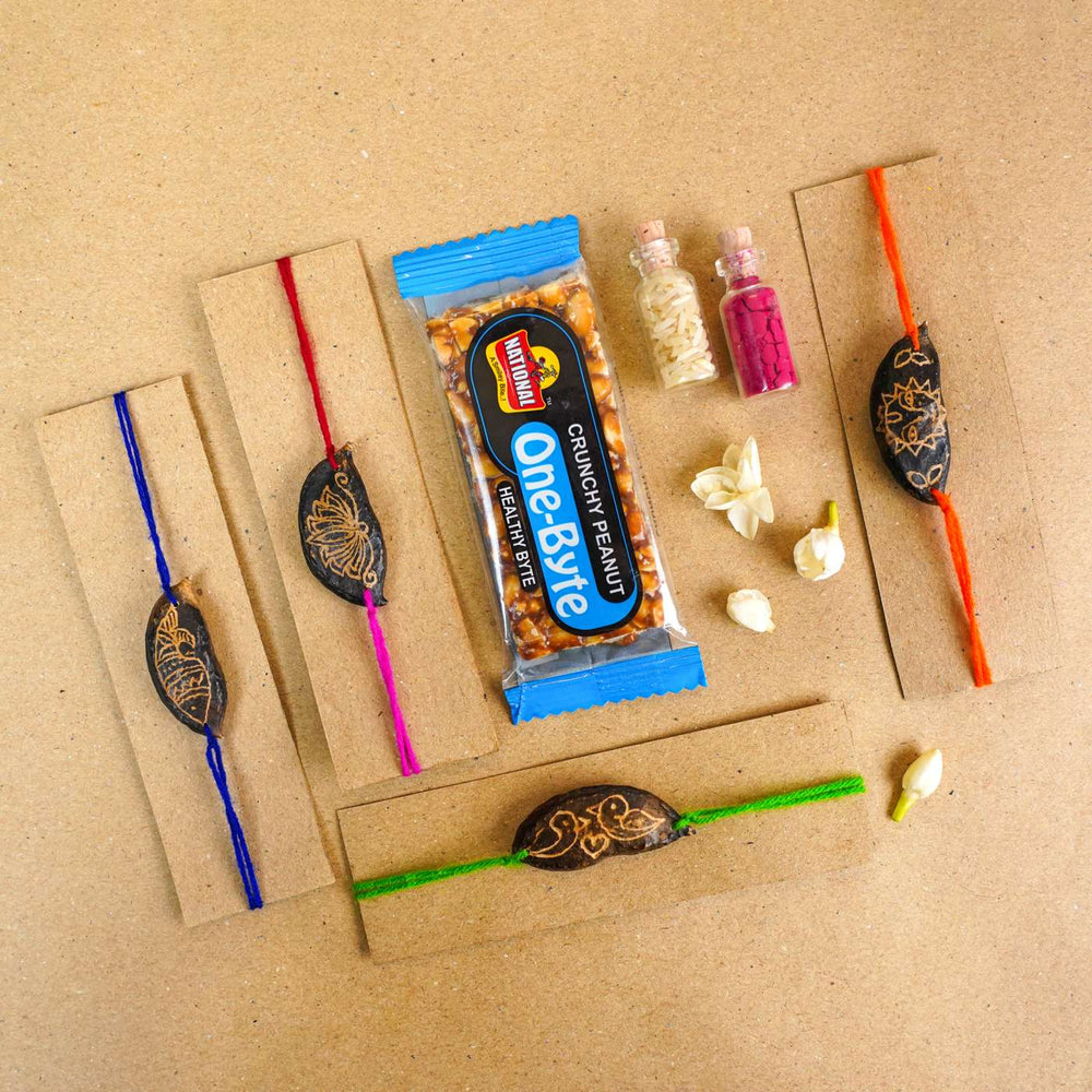 Handmade Plantable Ropan Seed Rakhi With Roli Chawal Set Of 4 - Rakhis with packaging and props