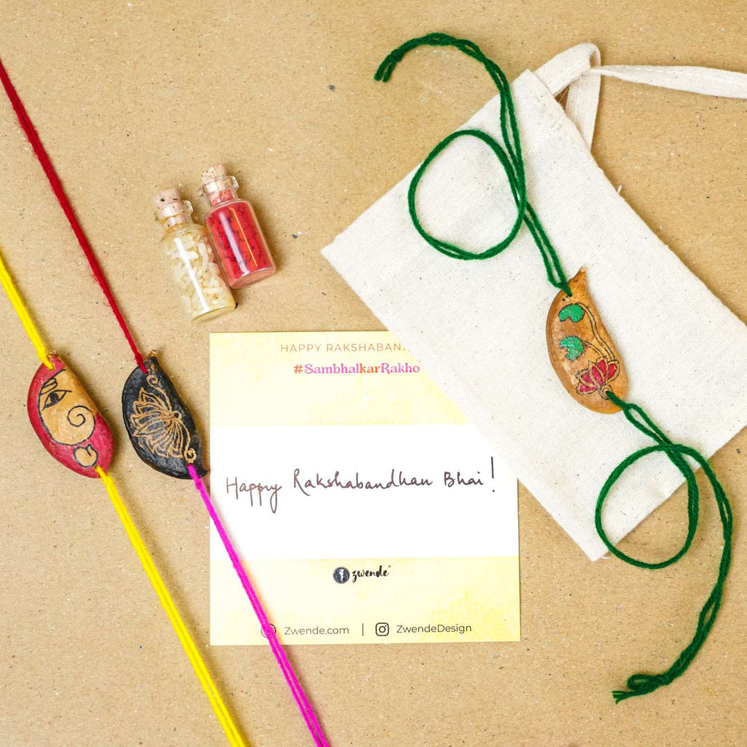 Handmade Plantable Magenta Lotus Seed Rakhi With Roli Chawal - Rakhi gift set with greeting card