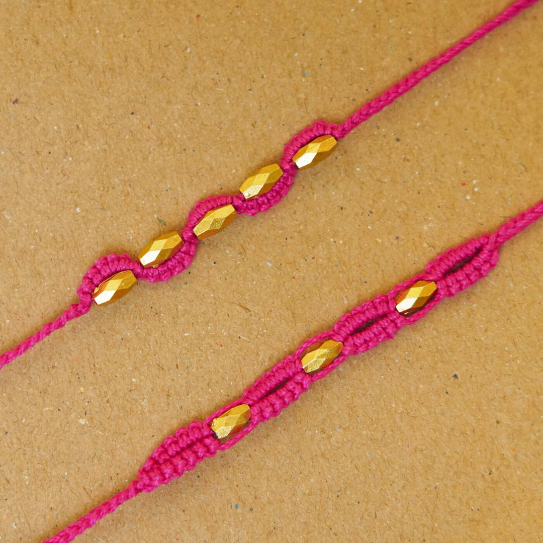 Handmade Macrame Beaded Rakhi With Roli Chawal Set Of 2 - Close-up of pink pair