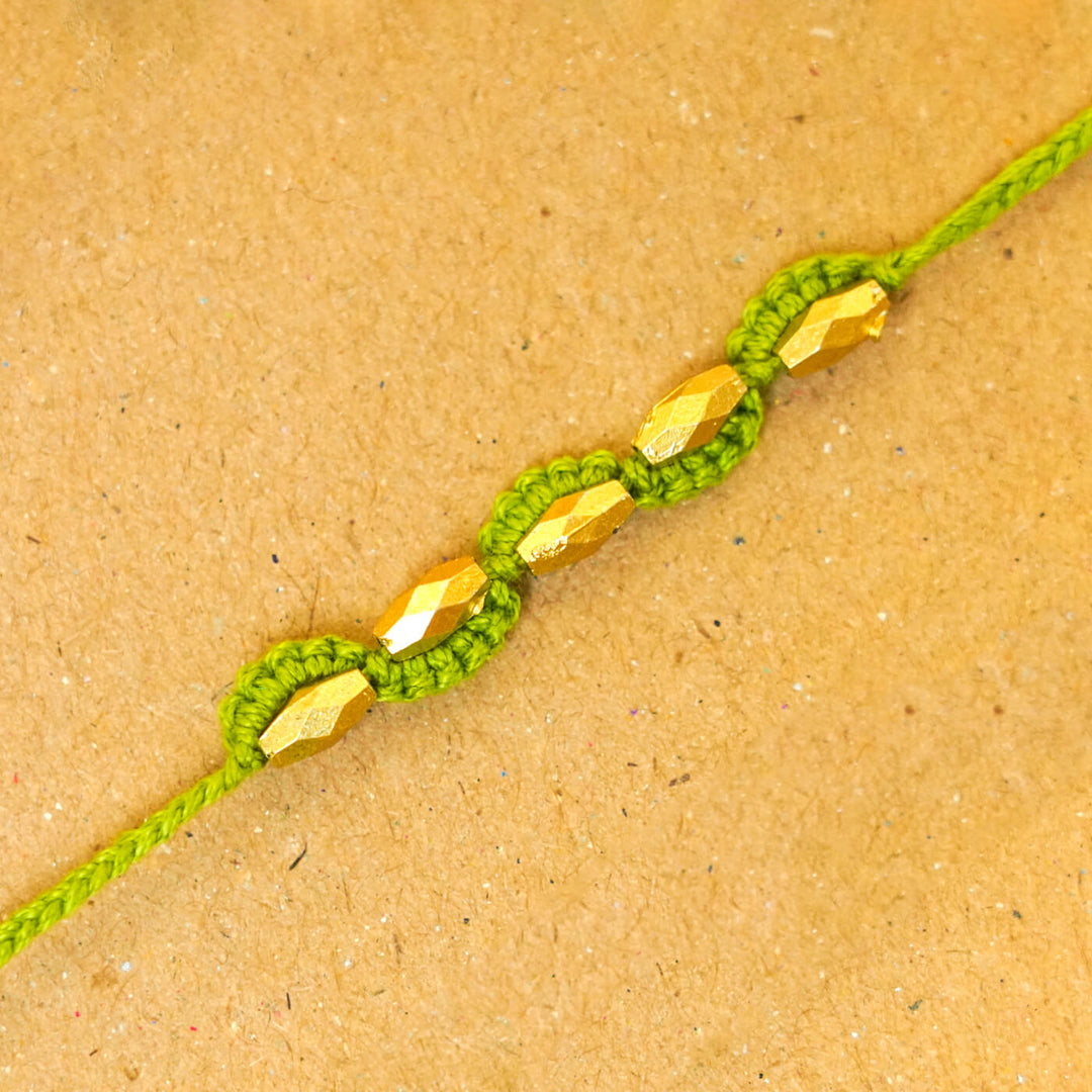 Handmade Macrame Five Gold Beaded Rakhi With Roli Chawal - Close-up Beaded Bracelet Detail (6)