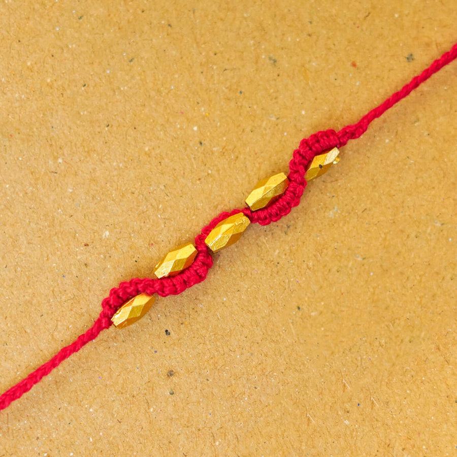 Handmade Macrame Five Gold Beaded Rakhi With Roli Chawal - Close-up Beaded Bracelet Detail