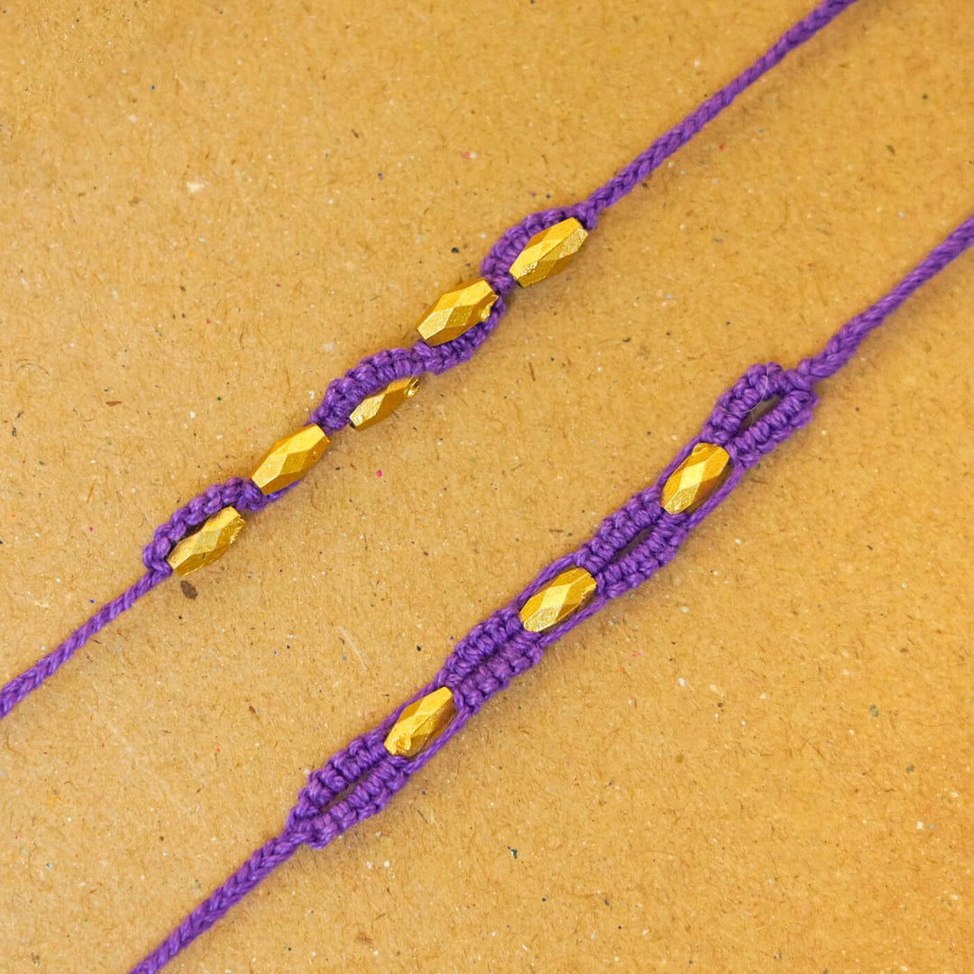 Handmade Macrame Beaded Rakhi With Roli Chawal Set Of 2 - Close-up of purple pair