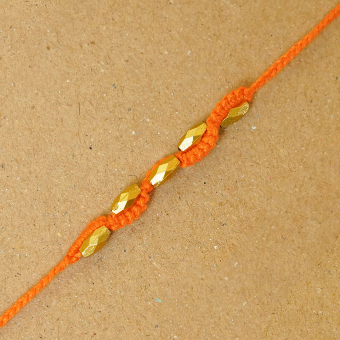 Handmade Macrame Five Gold Beaded Rakhi With Roli Chawal - Close-up Beaded Bracelet Detail (10)