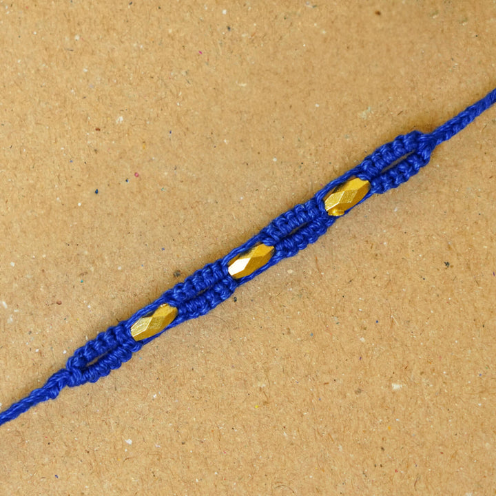 Handmade Macrame Three Gold Beaded Rakhi With Roli Chawal - Close-up Detail (3)