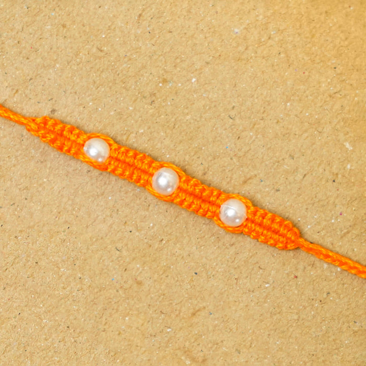 Handmade Macrame Three Pearl Rakhi With Roli Chawal - Close-up Front View (9)