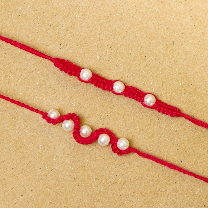 Handmade Macrame Beaded Rakhi With Roli Chawal Set Of 2 1 - Close-up of red rakhis