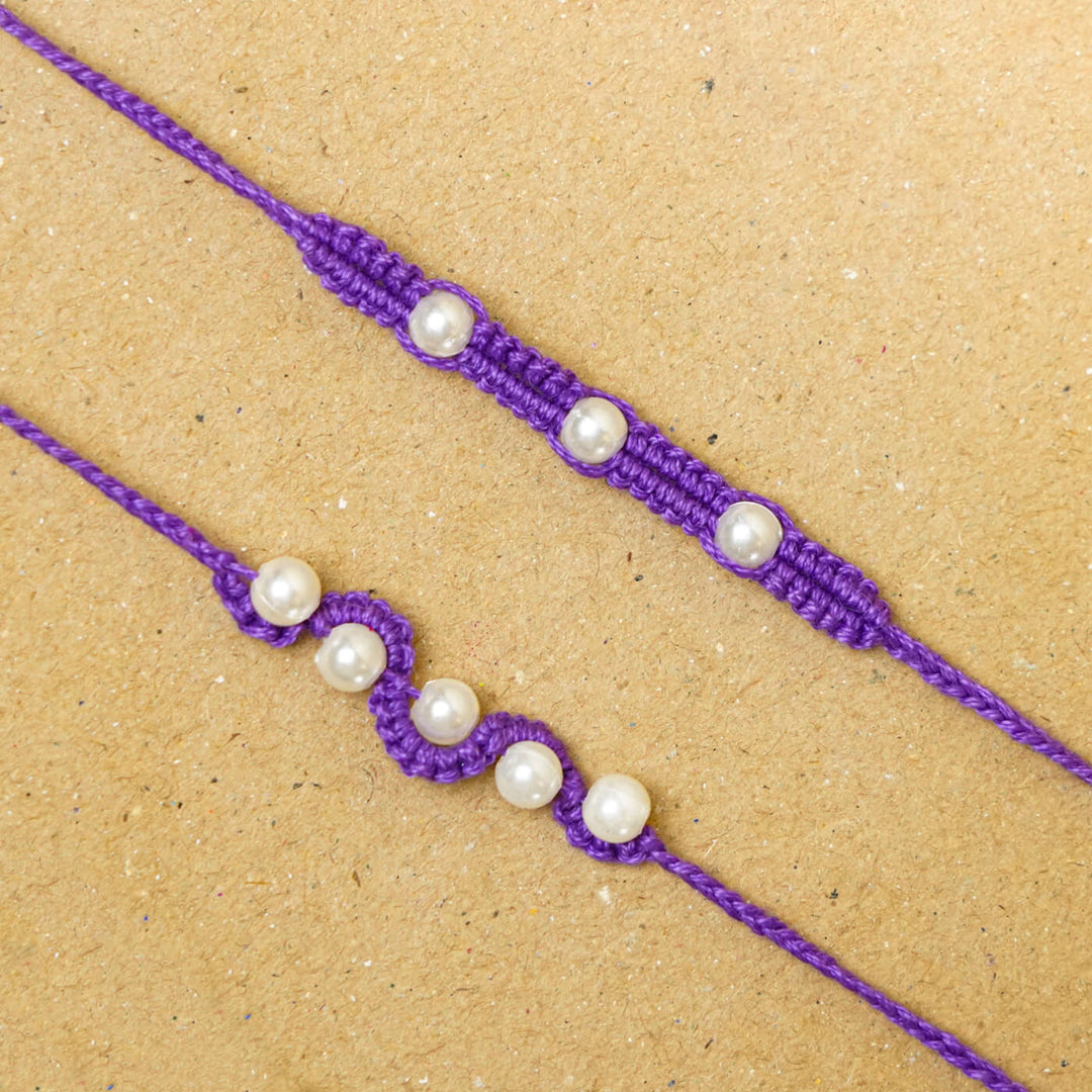 Handmade Macrame Beaded Rakhi With Roli Chawal Set Of 2 1 - Close-up of purple rakhis
