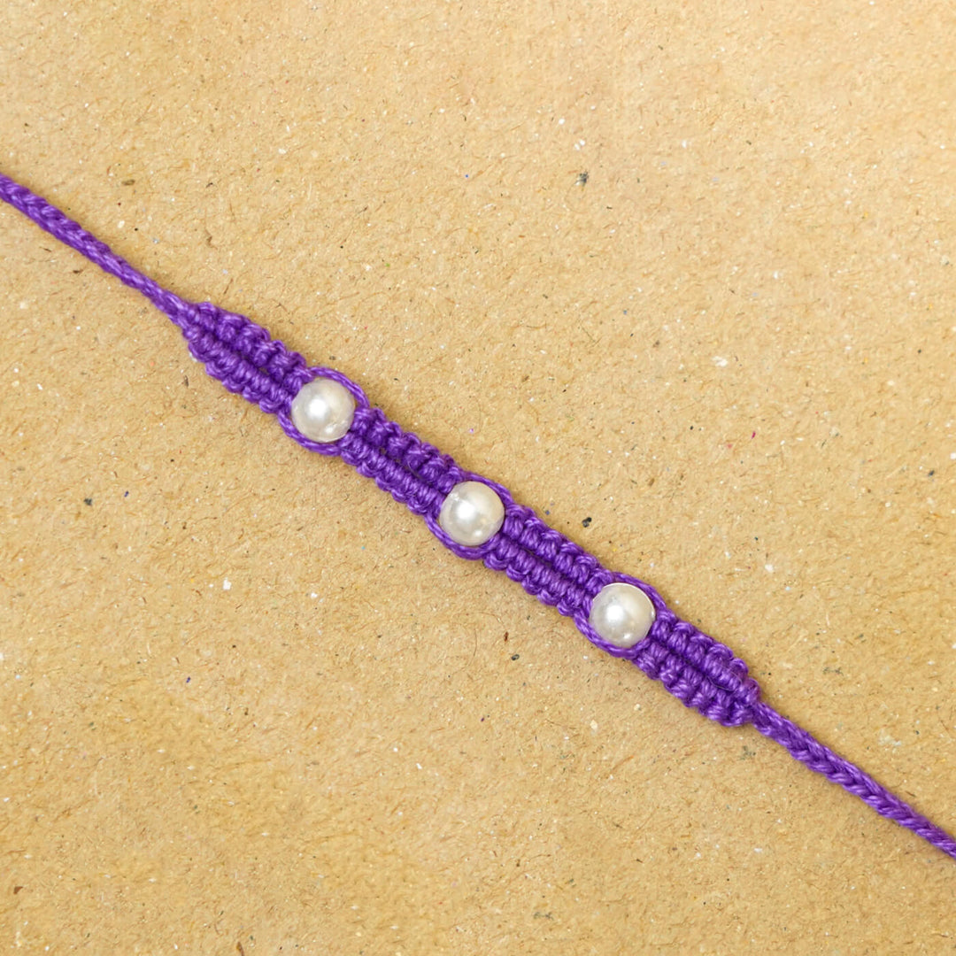 Handmade Macrame Three Pearl Rakhi With Roli Chawal - Close-up Front View (17)