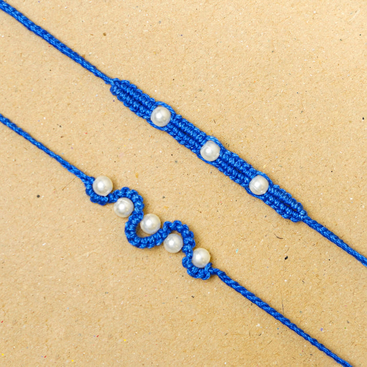 Handmade Macrame Beaded Rakhi With Roli Chawal Set Of 2 1 - Close-up of blue rakhis