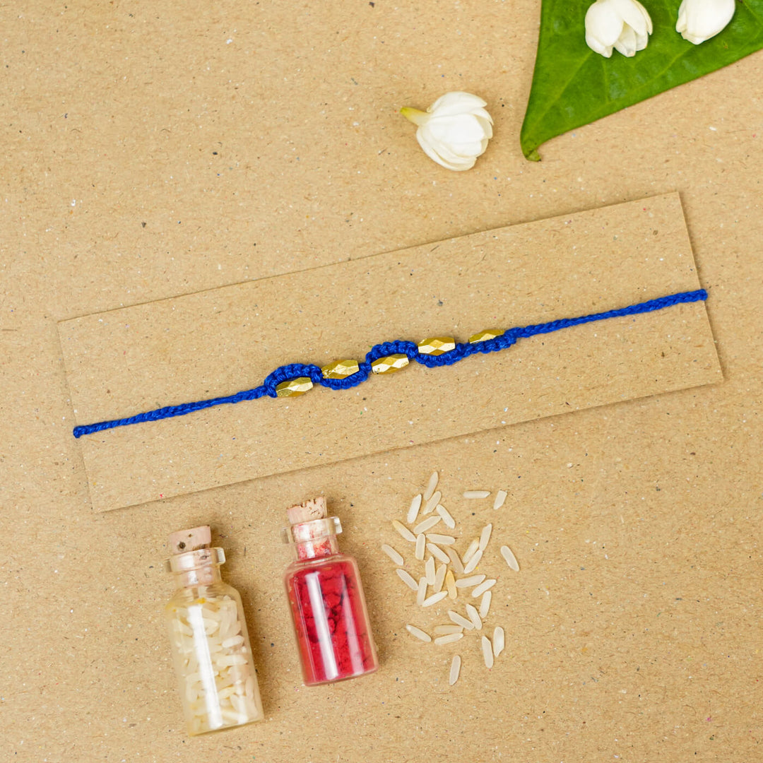 Handmade Macrame Five Gold Beaded Rakhi With Roli Chawal - Beaded Bracelet on Card with Flowers