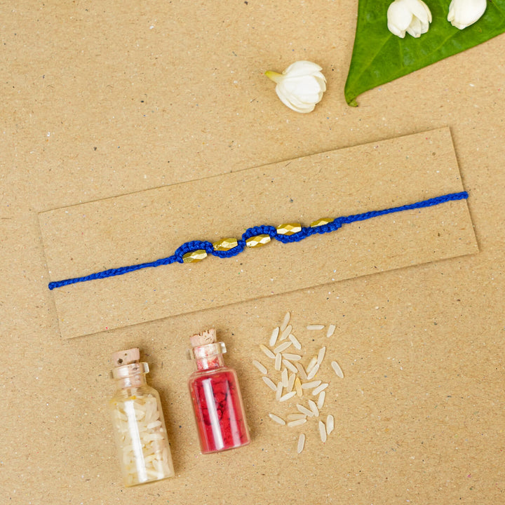 Handmade Macrame Five Gold Beaded Rakhi With Roli Chawal - Beaded Bracelet on Card with Flowers