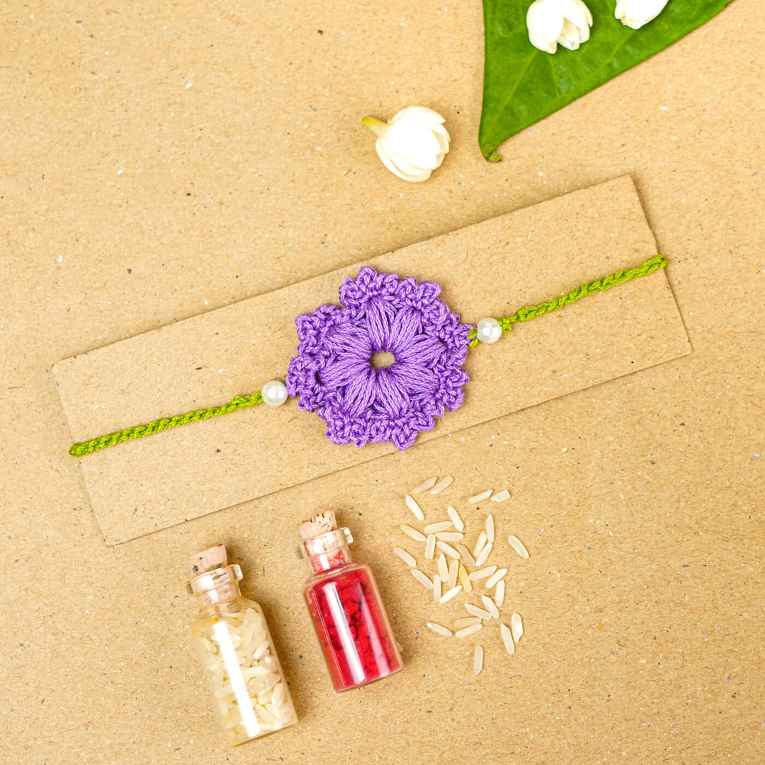 Handmade Crochet Floral Cotton Rakhi With Roli Chawal - Rakhi on packaging board