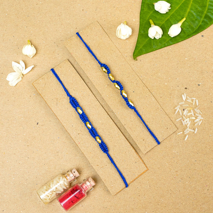 Handmade Macrame Beaded Rakhi With Roli Chawal Set Of 2 - Blue pair on card with decor