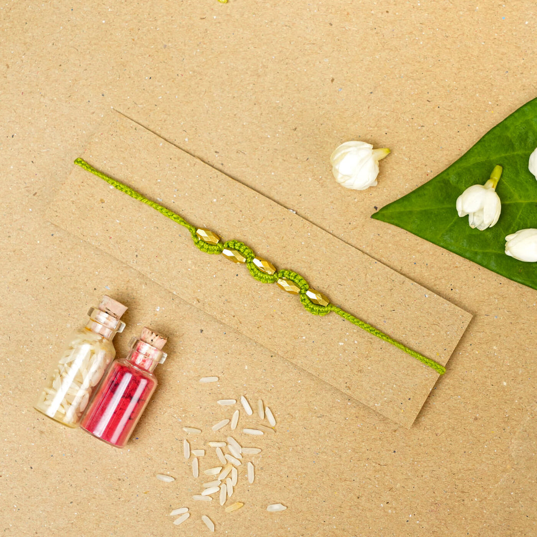 Handmade Macrame Five Gold Beaded Rakhi With Roli Chawal - Beaded Bracelet on Card with Flowers (7)