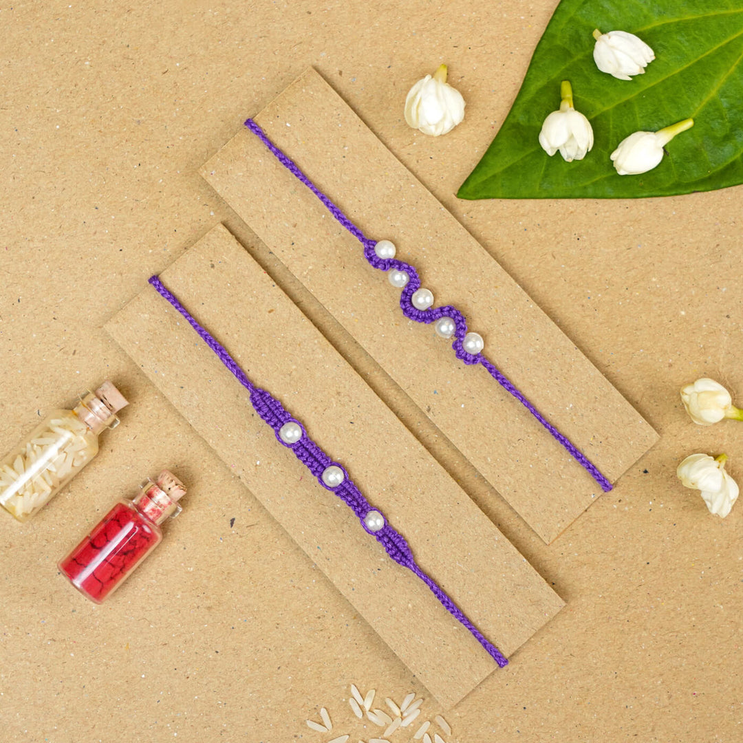 Handmade Macrame Beaded Rakhi With Roli Chawal Set Of 2 1 - Purple rakhis with gift pack