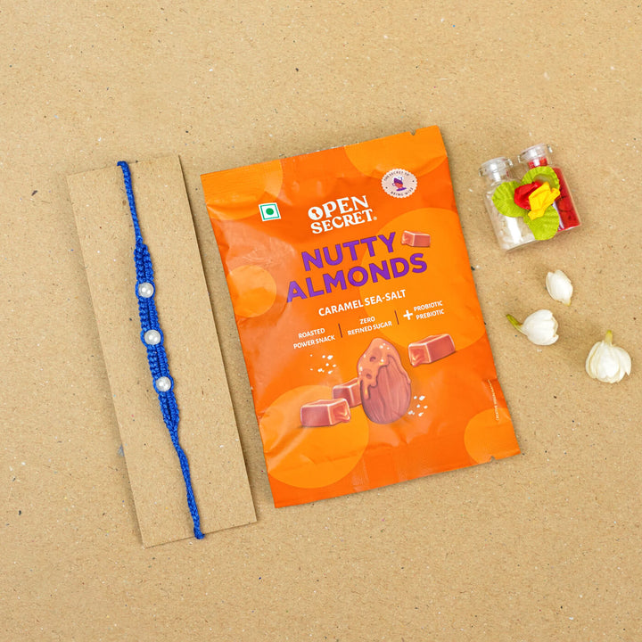 Handmade Macrame Three Pearl Rakhi With Roli Chawal - Flat Lay with Gift Packaging