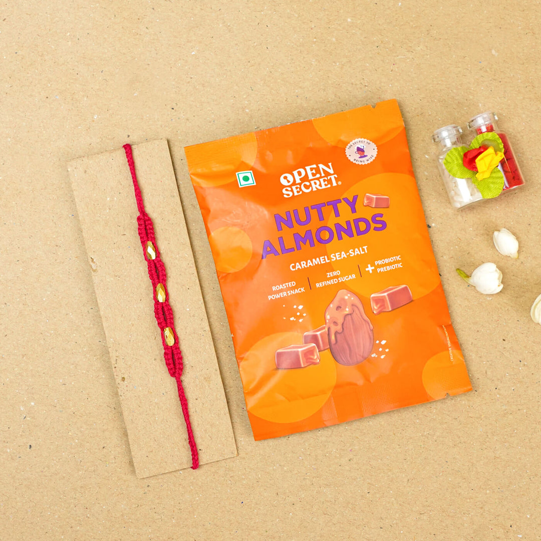 Handmade Macrame Three Gold Beaded Rakhi With Roli Chawal - Displayed on Card with Packaged Snack (23)