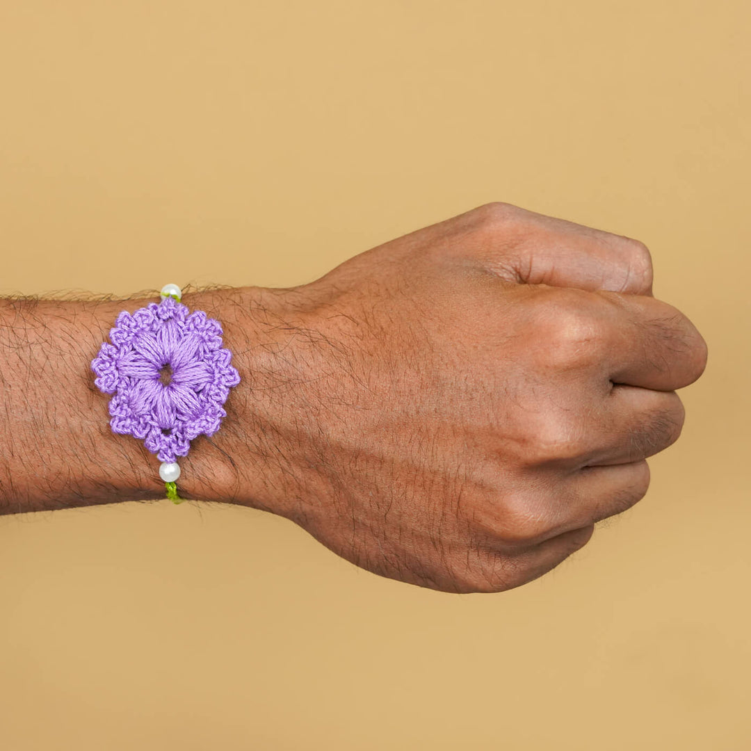 Handmade Crochet Floral Cotton Rakhi With Roli Chawal - Rakhi worn on wrist