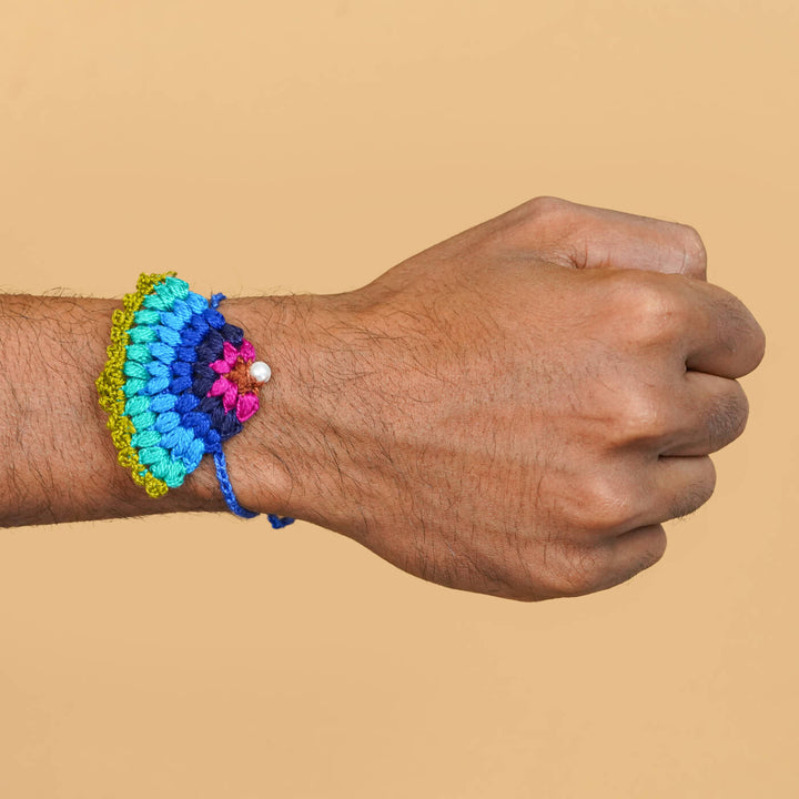 Handmade Crochet Peacock Cotton Rakhi With Roli Chawal - Rakhi worn on wrist