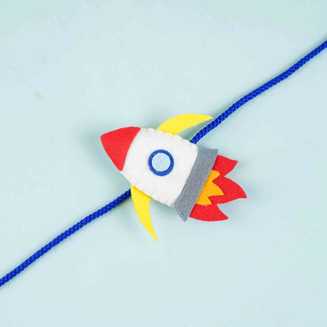 Handmade Felt Rocket Kids Rakhi With Roli Chawal - Close-up of Single Rocket Charm