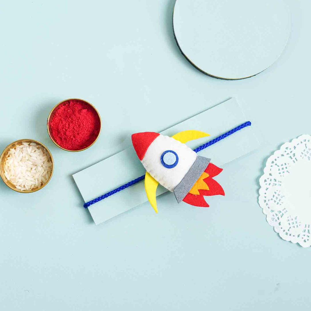 Handmade Felt Rocket Kids Rakhi With Roli Chawal - Rocket Charm with Rakhi Packaging