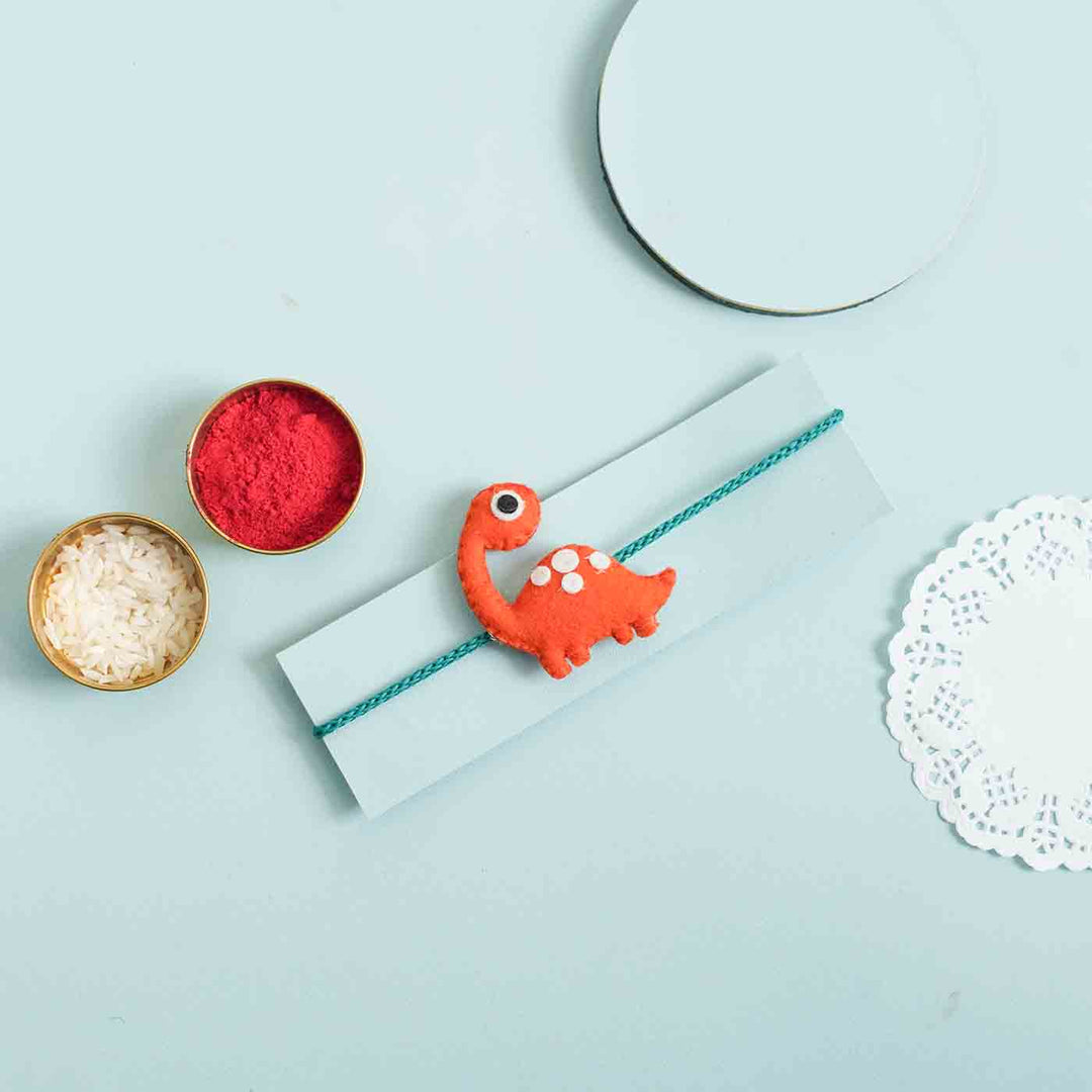 Handmade Dinosaur Felt Kids Rakhi With Roli Chawal - Dinosaur Rakhi with Festival Items