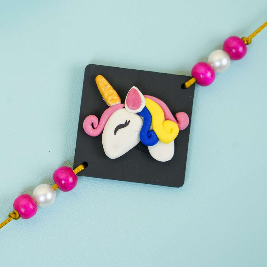 Handmade Miniature Clay Unicorn Kids Rakhi With Roli Chawal - Close-up of Unicorn Rakhi