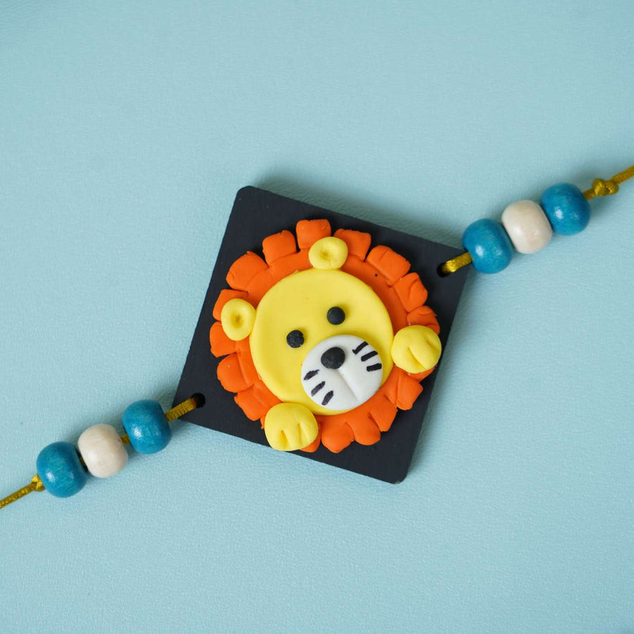 Handmade Miniature Clay Lion Themed Kids Rakhi With Roli Chawal - Close-up of Lion Rakhi
