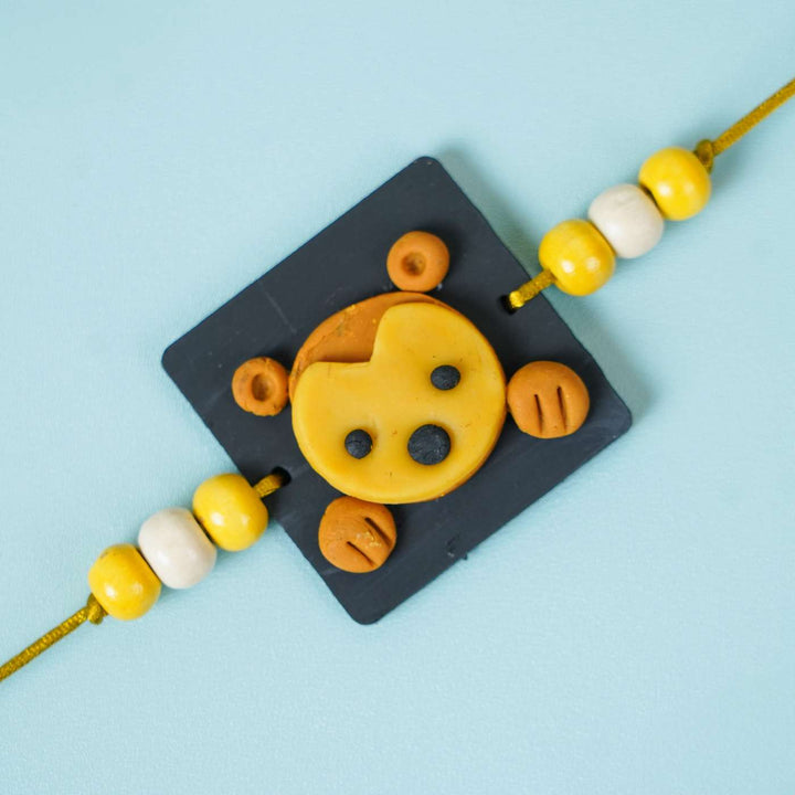 Handmade Miniature Clay Monkey Themed Kids Rakhi With Roli Chawal - Close-up of Bracelet Charm