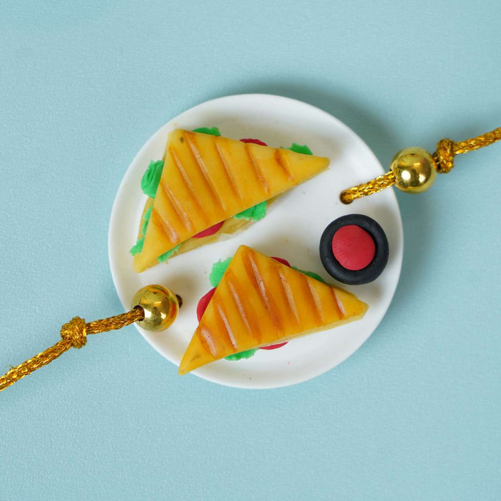 Handmade Miniature Clay Sandwich Rakhi With Roli Chawal - Close-up of sandwich design