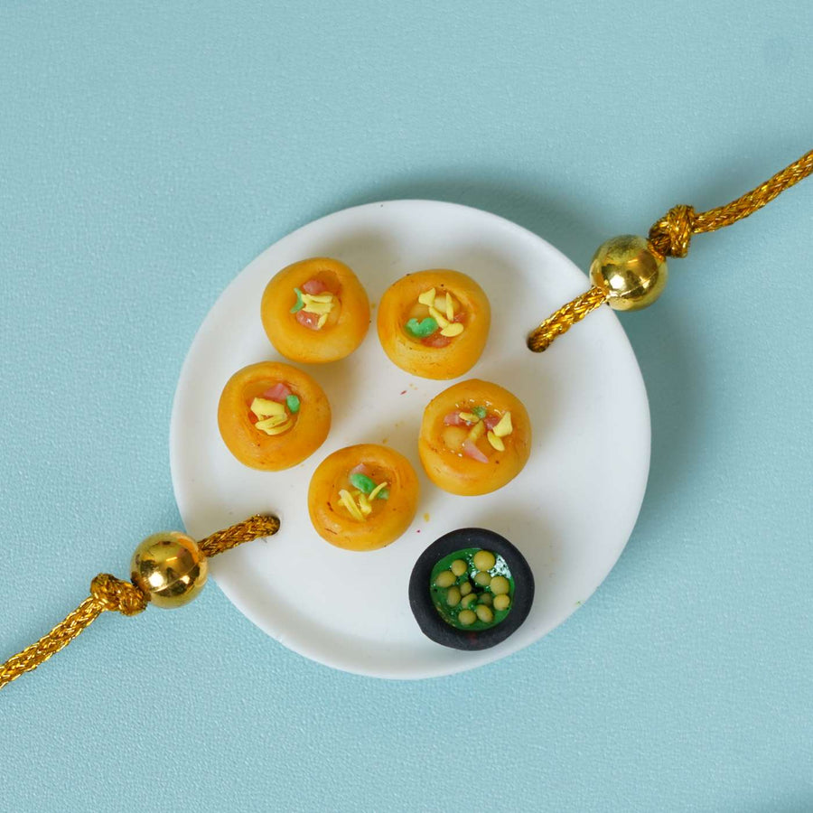 Handmade Miniature Clay Pani Puri Rakhi With Roli Chawal - Close-up of Rakhi detail