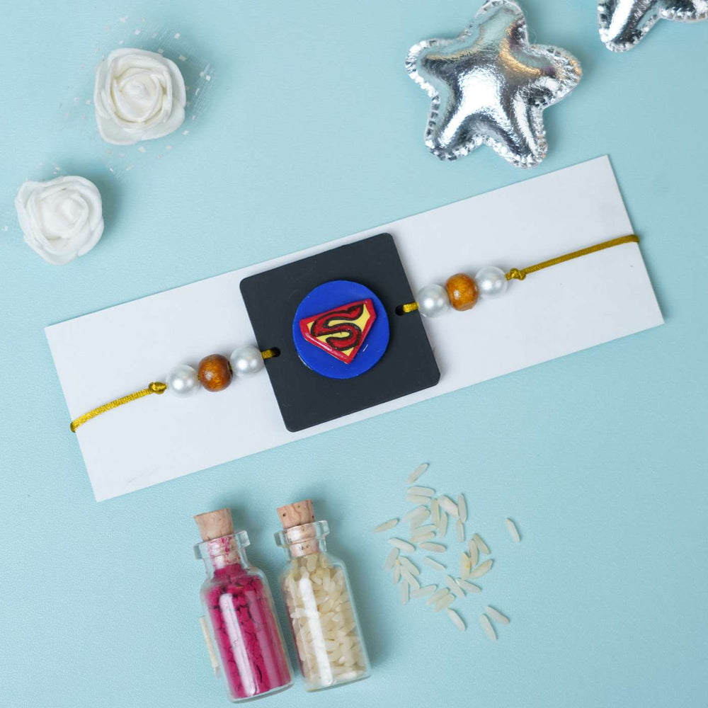 Handmade Miniature Clay Superman Kids Rakhi With Roli Chawal - Styled Product with Decorative Items