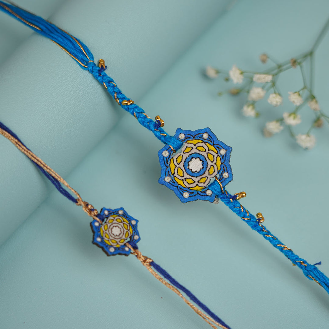 Handmade Blue Jaipuri Ghungroo And Shell Wooden Bhaiya Bhabhi Rakhi With Roli Chawal - Two Bracelet Front View