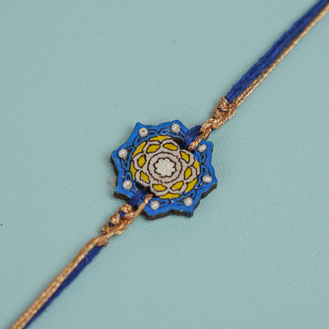Handmade Blue Jaipuri Ghungroo And Shell Wooden Bhaiya Bhabhi Rakhi With Roli Chawal - Bracelet Close-up Detail