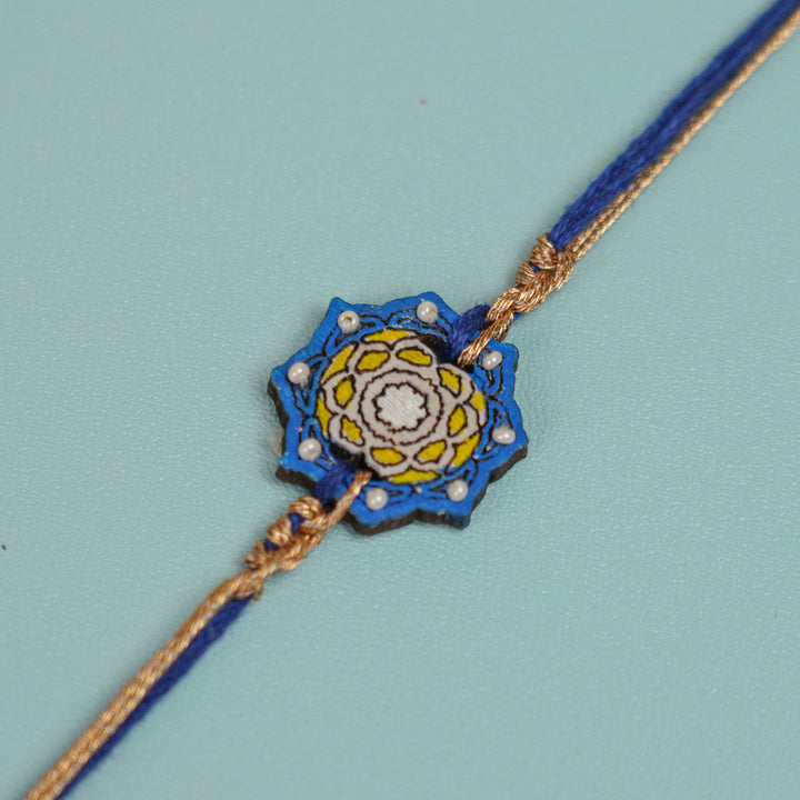 Handmade Blue Jaipuri Ghungroo And Shell Wooden Bhaiya Bhabhi Rakhi With Roli Chawal - Bracelet Close-up Detail