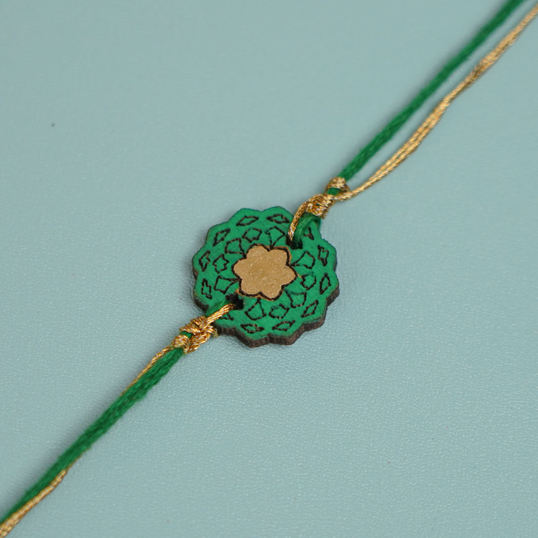 Handmade Green Flower Shape Ghungroo And Shell Wooden Bhaiya Bhabhi Rakhi With Roli Chawal - Close-up Showing String Design