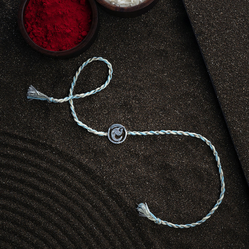 Handmade Ashtavinayak 925 Silver Rakhi With Roli Chawal For Brother - Full bracelet laid flat with bowls