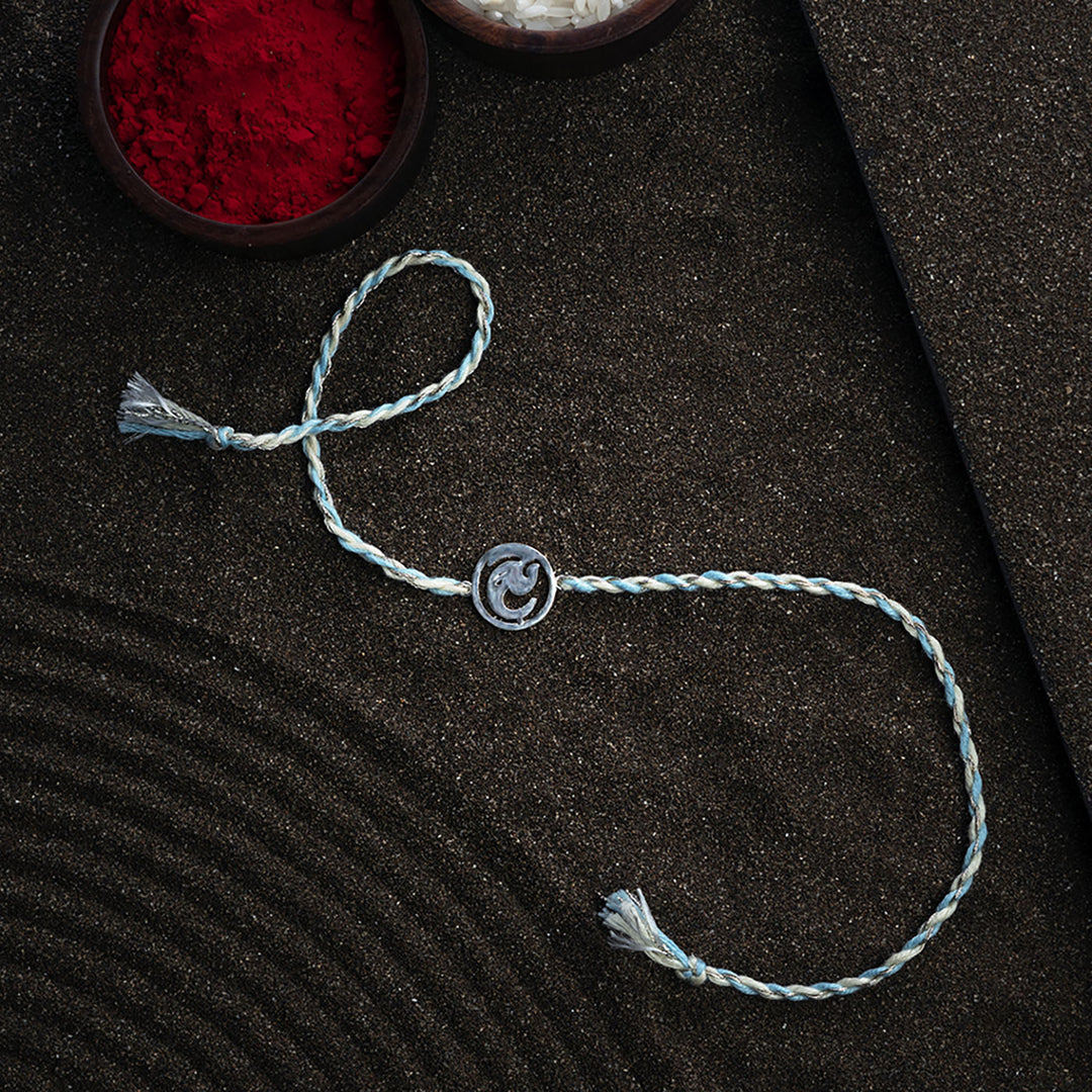 Handmade Ashtavinayak 925 Silver Rakhi With Roli Chawal For Brother - Full bracelet laid flat with bowls